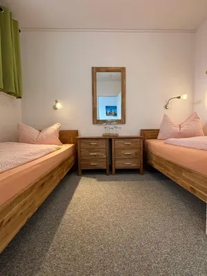 Ein Bett oder Betten in einem Zimmer der Unterkunft Haus Poseidon, Ferienwohnung POS29