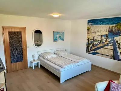 Ein Bett oder Betten in einem Zimmer der Unterkunft Haus Elbe -Wohnung 14- Zentral in Döse