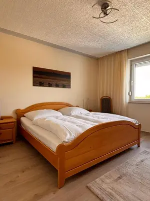Ein Bett oder Betten in einem Zimmer der Unterkunft Haus Poseidon, Ferienwohnung POS31