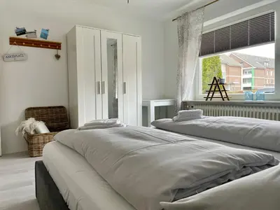 Ein Bett oder Betten in einem Zimmer der Unterkunft Strandrevier No4