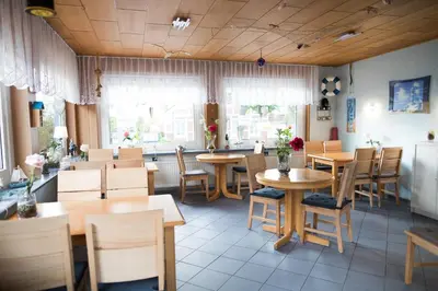 Ein Restaurant oder anderes Speiselokal in der Unterkunft Haus Meereswoge