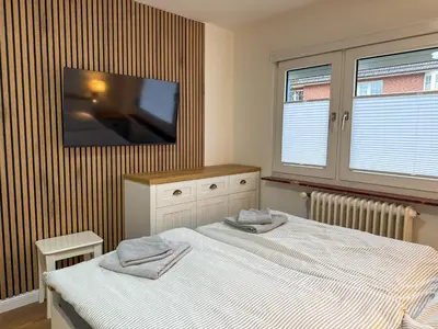 Ein Bett oder Betten in einem Zimmer der Unterkunft Haus Meereswoge