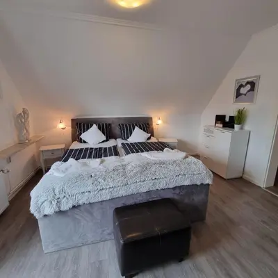 Ein Bett oder Betten in einem Zimmer der Unterkunft Haus Kaiser Ferienwohnung 7 Deichblick