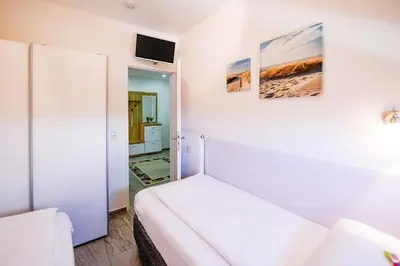 Ein Bett oder Betten in einem Zimmer der Unterkunft Strandhochhaus SA05