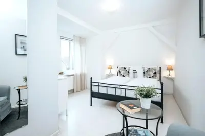 Ein Bett oder Betten in einem Zimmer der Unterkunft Hotel Kleiner Yachthafen