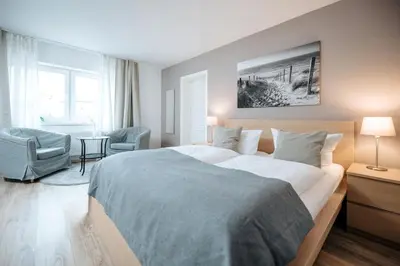 Ein Bett oder Betten in einem Zimmer der Unterkunft Hotel Kleiner Yachthafen