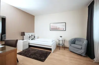 Ein Bett oder Betten in einem Zimmer der Unterkunft Hotel Kleiner Yachthafen