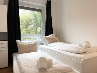 Ein Bett oder Betten in einem Zimmer der Unterkunft Seaside 53° FeWo 1