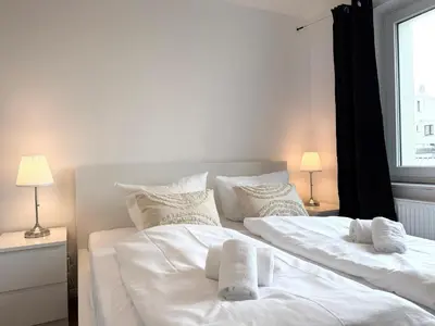 Ein Bett oder Betten in einem Zimmer der Unterkunft Seaside 53° FeWo 1