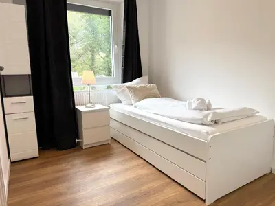 Ein Bett oder Betten in einem Zimmer der Unterkunft Seaside 53° FeWo 1