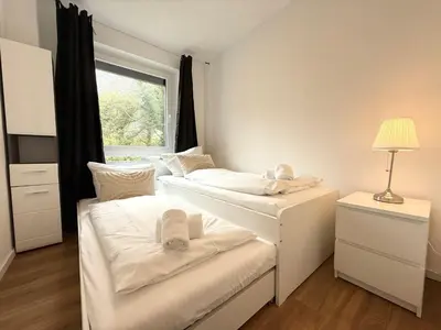 Ein Bett oder Betten in einem Zimmer der Unterkunft Seaside 53° FeWo 1