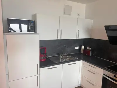 Küche/Küchenzeile in der Unterkunft Duhner Spitze Wohnung 12