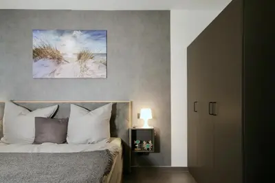 Ein Bett oder Betten in einem Zimmer der Unterkunft Duhner Spitze FEWO44