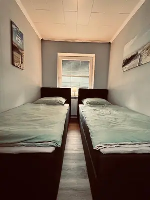 Ein Bett oder Betten in einem Zimmer der Unterkunft Apartment 3 - Haus Heinke am Deich