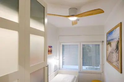 Ein Bett oder Betten in einem Zimmer der Unterkunft Strandhochhaus SHC5