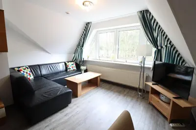 Ein Sitzbereich in der Unterkunft Itjen am Strand Wohnung 1 Grün