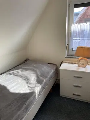 Ein Bett oder Betten in einem Zimmer der Unterkunft 