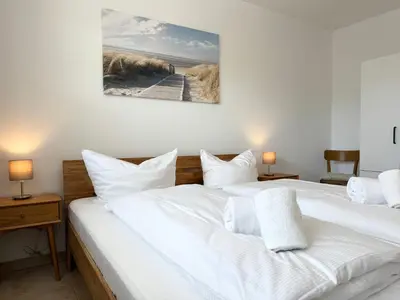 Ein Bett oder Betten in einem Zimmer der Unterkunft Haus am Waldbad FeWo 2