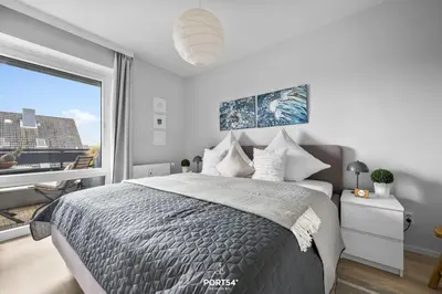 Ein Bett oder Betten in einem Zimmer der Unterkunft Ferienwohnung Bake 21