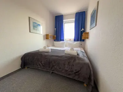 Ein Bett oder Betten in einem Zimmer der Unterkunft Haus Seewind Wohnung 3