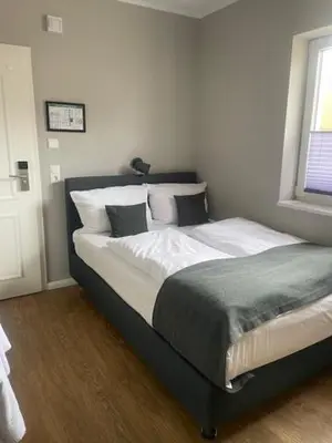 Ein Bett oder Betten in einem Zimmer der Unterkunft Hotel Astra Maris