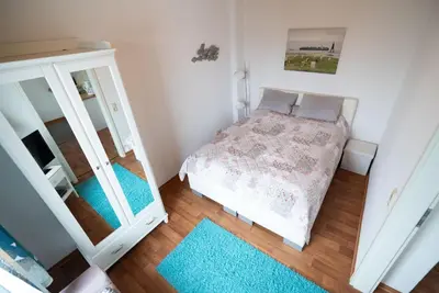 Ein Bett oder Betten in einem Zimmer der Unterkunft Haus Kehrwieder Wohnung Südsee