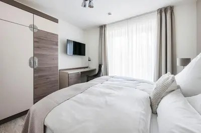 Ein Bett oder Betten in einem Zimmer der Unterkunft Haus Deichkieker Apartment 3 1 Strandsegler