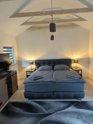 Ein Bett oder Betten in einem Zimmer der Unterkunft Lütt achtern Diek