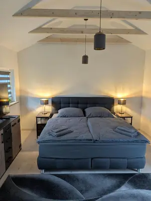 Ein Bett oder Betten in einem Zimmer der Unterkunft Lütt achtern Diek