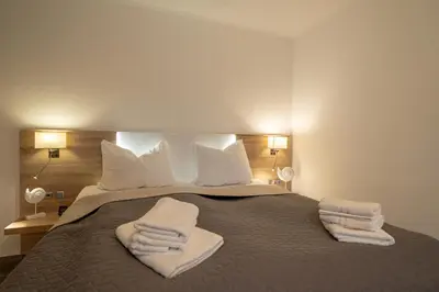 Ein Bett oder Betten in einem Zimmer der Unterkunft Ferienwohnung Glück & Seelig