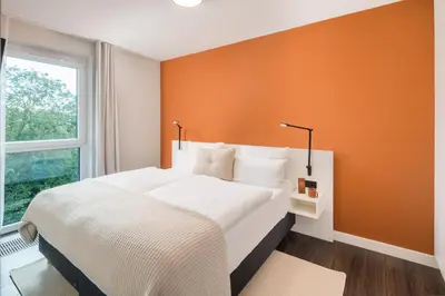 Ein Bett oder Betten in einem Zimmer der Unterkunft Überwasser Hotel