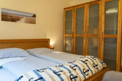 Ein Bett oder Betten in einem Zimmer der Unterkunft Strandresidenz Rosengarten