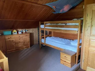 Ein Bett oder Betten in einem Zimmer der Unterkunft Feriendomizil Haus Störtebeker