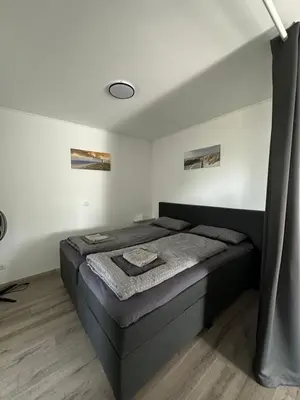 Ein Bett oder Betten in einem Zimmer der Unterkunft Star Ferien Appartement