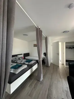 Ein Bett oder Betten in einem Zimmer der Unterkunft Star Ferien Appartement