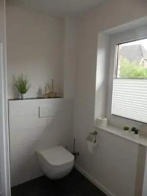 Ein Badezimmer in der Unterkunft 6 Personen Ferienhaus mit Sauna, Whirlpool, zwei Duschen sowie Kaminofen in Otterndorf