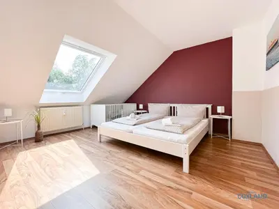 Ein Bett oder Betten in einem Zimmer der Unterkunft Ferienhaus Bremer Str 6