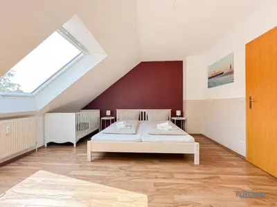 Ein Bett oder Betten in einem Zimmer der Unterkunft Ferienhaus Bremer Str 6