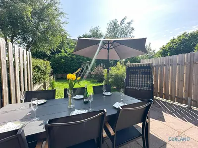Ein Garten an der Unterkunft Ferienhaus Bremer Str 6