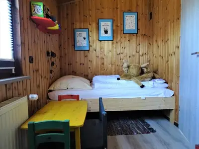 Ein Bett oder Betten in einem Zimmer der Unterkunft 4 Personen Ferienhaus Windrose mit Kanu in Otterndorf