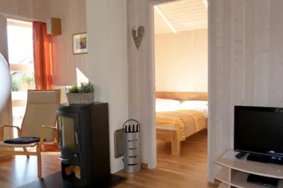 Ein Bett oder Betten in einem Zimmer der Unterkunft 6 Personen kinderfreundliches Ferienhaus mit Sauna, Whirlpool und Kaminofen in Otterndorf