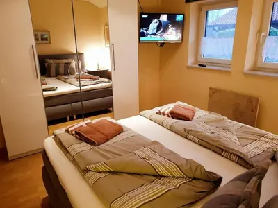 Ein Bett oder Betten in einem Zimmer der Unterkunft 4 Personen Ferienhaus mit Sauna und zwei Toiletten in Otterndorf