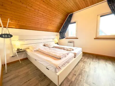 Ein Bett oder Betten in einem Zimmer der Unterkunft Wattenmeerbrise