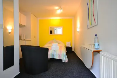 Ein Bett oder Betten in einem Zimmer der Unterkunft Ferienanlage Duhnen Haus 23