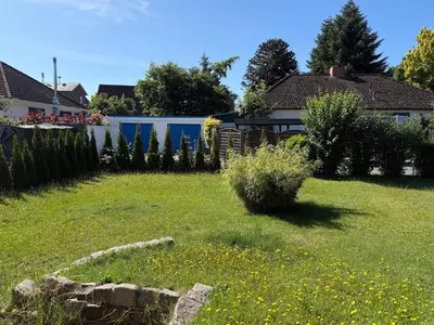 Ein Garten an der Unterkunft FeWo 1