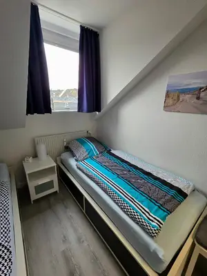 Ein Bett oder Betten in einem Zimmer der Unterkunft Ferienwohnung Hafenkajüte