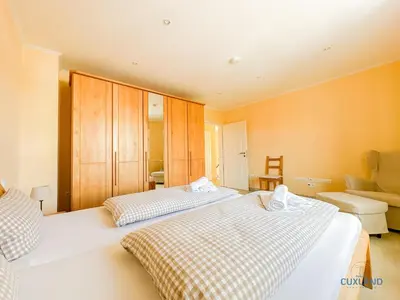 Ein Bett oder Betten in einem Zimmer der Unterkunft Ferienhaus Kugelbake