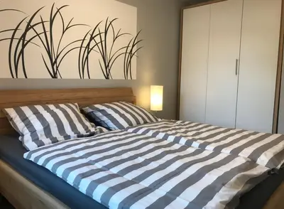 Ein Bett oder Betten in einem Zimmer der Unterkunft De lütte Warftkieker