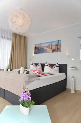Ein Bett oder Betten in einem Zimmer der Unterkunft Hotel Neptuns Ankerplatz & Zur Seerobbe