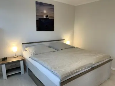 Ein Bett oder Betten in einem Zimmer der Unterkunft MeeresZeit
